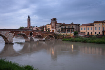 Fototapeta na wymiar The famous Stone Bridge (Ponte di Piettra) over Adige river in Verona old town at sunrise, Verona, Veneto Region, Italy