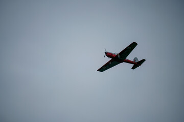 1951 DHC-1 Chipmunk WD363 22 C-N C1-0304 flies low overhead in a blue and grey cloud winter sky