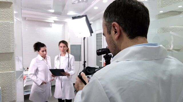 Backstage of shooting session at the dental cabinet, photographers and videographers at work