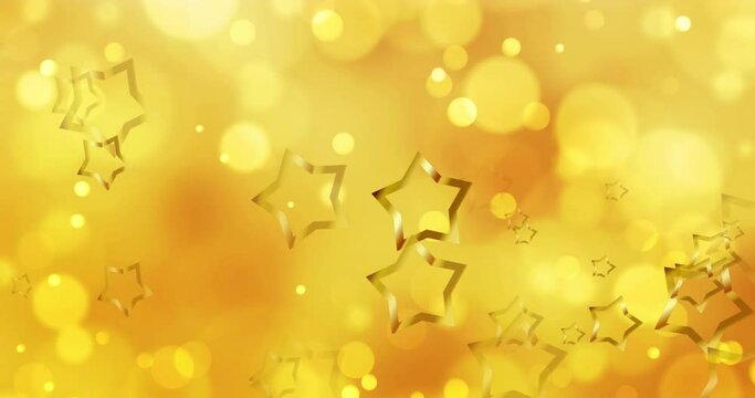 Animation of gold christmas stars and moving yellow bokeh light spots light on orange background