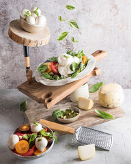 Caprese salad and cheese in levitation
