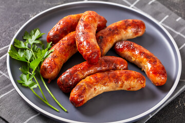 fried sausages on a plate, top view