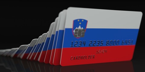 Domino effect, fallen credit cards with flags of Slovenia. Fictional data on card mockups. Banking collapse conceptual 3d rendering