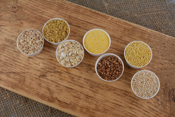 Large group of wholegrain food shot on rustic wooden table
