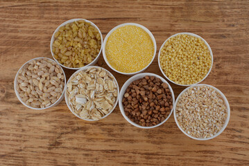 Large group of wholegrain food shot on rustic wooden table