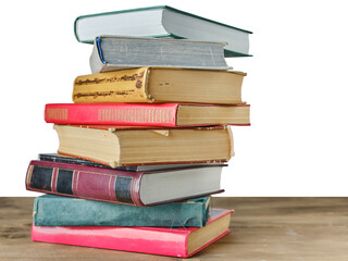 Stack of old books on table with isolated background