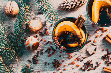 Fototapeta na wymiar mulled wine, fir branches, cinnamon - comforting Christmas drink