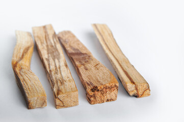 Palo Santo bars close-up and copy space. Ritual cleansing with sacred ibiocai, meditation, aromatherapy with incense and candles..