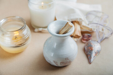 Palo Santo bars close-up and copy space. Ritual cleansing with sacred ibiocai, meditation, aromatherapy with incense and candles..