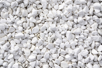 Pure white pebble texture. Small stones on the ground.