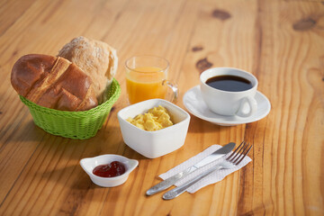 Continental breakfast on wooden background