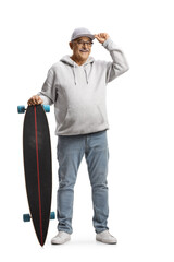 Full length portrait of a cheerful mature man greeting with a cap and holding a longboard © Ljupco Smokovski