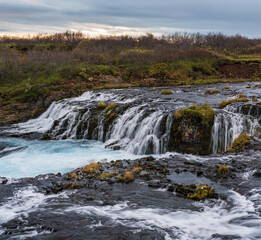 Picturesque waterfall Bruarfoss autumn view. Season changing in southern Highlands of Iceland.