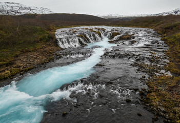 Picturesque waterfall Bruarfoss autumn view. Season changing in southern Highlands of Iceland.