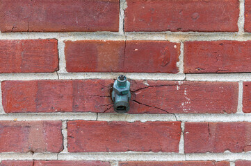 old tap and bricks