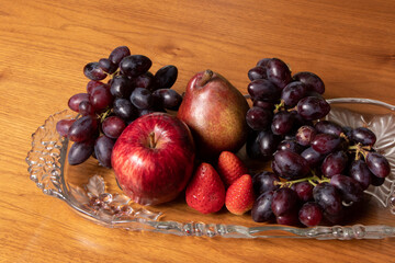 delicious fruits, apples and grapes on wooden table, top view photo with space for text