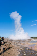 Impressive view of Icelands Geysir Geisir in the Golden Circule, the geothermal activity and a attraction for tourists in Iceland