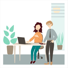 A girl sits in an office at a desk and discusses work with an employee.