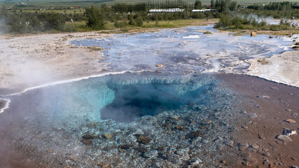 Impressive view of Icelands Geysir Geisir in the Golden Circule, the geothermal activity and a...