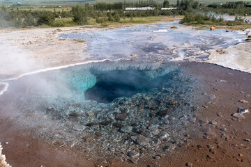 Impressive view of Icelands Geysir Geisir in the Golden Circule, the geothermal activity and a attraction for tourists in Iceland