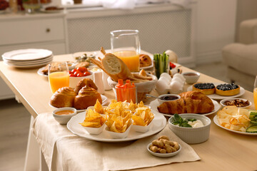 Dishes with different food on table in room. Luxury brunch