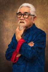 chinese old man wearing eyeglasses with white hair and beard