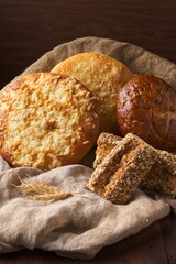 Whole grain breads displayed on burlap.