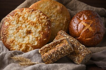Round and baguette loafs of whole bread.