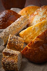 Assorted whole grain breads and baguettes.
