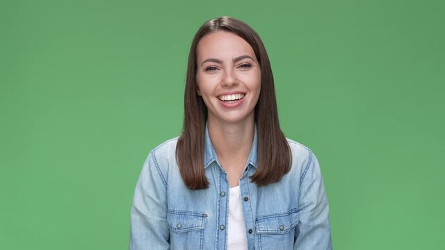 Yeah it is me lady point thumbs her self isolated green color background 