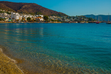 BODRUM, TURKEY: View of Bodrum Beach, Aegean sea, traditional white houses, marina, sailing boats, yachts in Bodrum.
