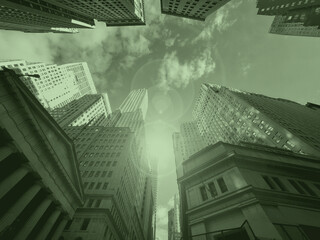 Looking up at the skyline buildings of Wall Street in New York City with money green color effect