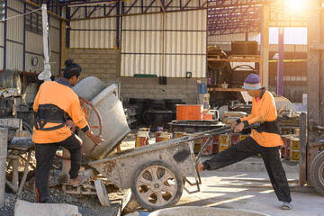 Constuction details - worker laying cement or concrete with brickbloc