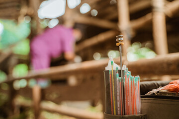 hand preparing the tools for artificial insemination of cow.