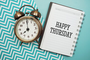 Happy Thursday text and alarm clock on blue background