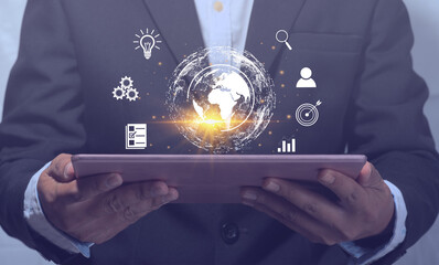 Businessman holding a tablet, displaying information, networking online, to the world, communication concept, use of technology for work, business, online, information search, global and big data.
