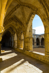 Fototapeta na wymiar Gallery with arches in courtyard of medieval Cathedral of Saint Nazaire, Beziers