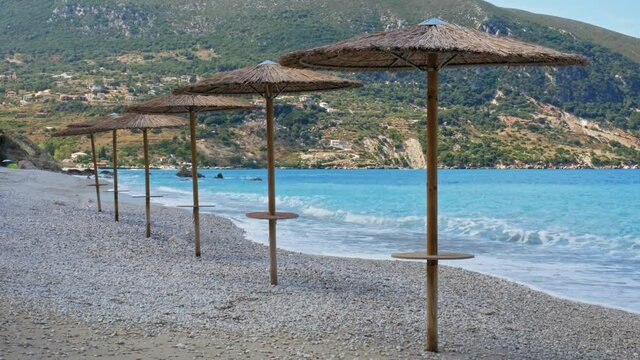 Waves Crashing In Pebble Beach Of  Agia Kyriaki Beach In Kefalonia Greece - wide shot