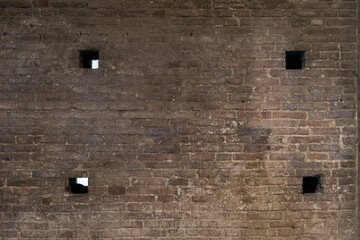 old brick wall with hole