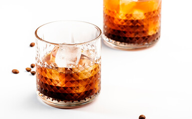 Black russian cocktail, trendy alcoholic drink with vodka, coffee liqueur and ice, white...