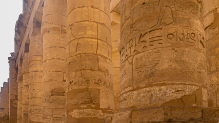 Colonnade in the ancient Karnak temple of Luxor. Close-up. The stone texture of the columns,...