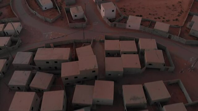 fast aerial drone movement above old empty arabic city in the desert at morining