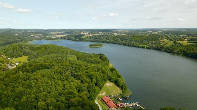 Panorama Of Lush Green Forest And Radun Lake In Borucino Village In Northern Poland. aerial