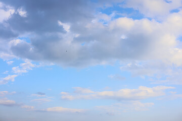 blue sky background with tiny clouds