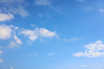 blue sky background with tiny clouds