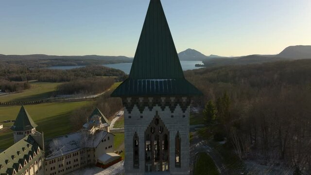 Ancient Intricate Design Of The Church Tower of Abbaye de St. Benoit Du Lac - aerial shot
