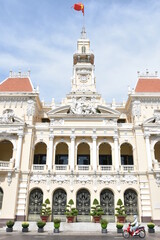 People's Committee of Ho Chi Minh City Center Facade Detail Portrait with Motorbike Riding Past