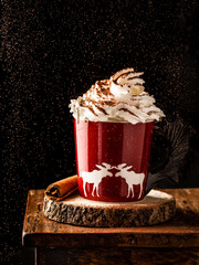 Christmas drink. Hot chocolate with whipped cream. Sprinkle the hot chocolate with cocoa powder.