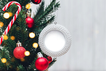 Blank round Christmas ornament mockup on Christmas tree. Holiday festive concept, Christmas mock up.