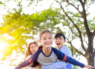 Fototapeta premium Happy Family having fun in the park